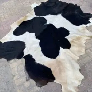 Natural Cowhide rug from Egypt in the color black, white and tan