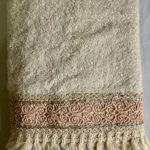 cream hand towel with pink lace and fringes