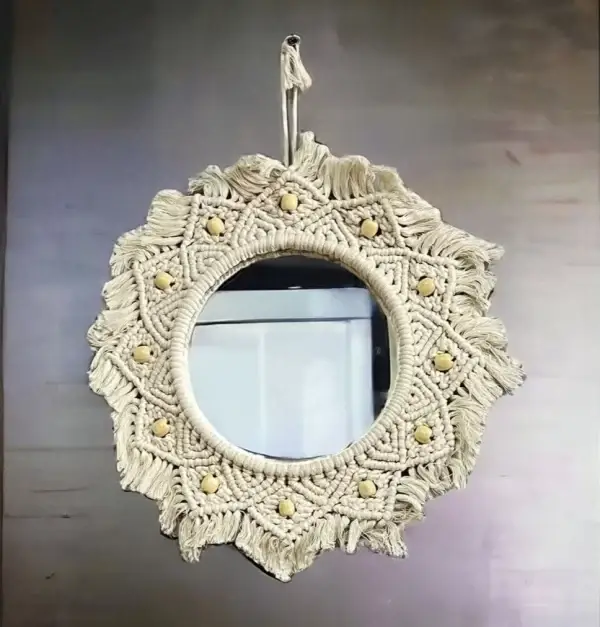 Handmade round Macrame mirror hanging on a wall