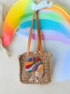 Handcrafted Brown Crochet Bag with Vibrant African Woman Design