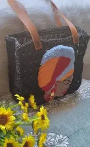 Handmade Black Crochet Bag with Vibrant African Woman Punch Needle Design