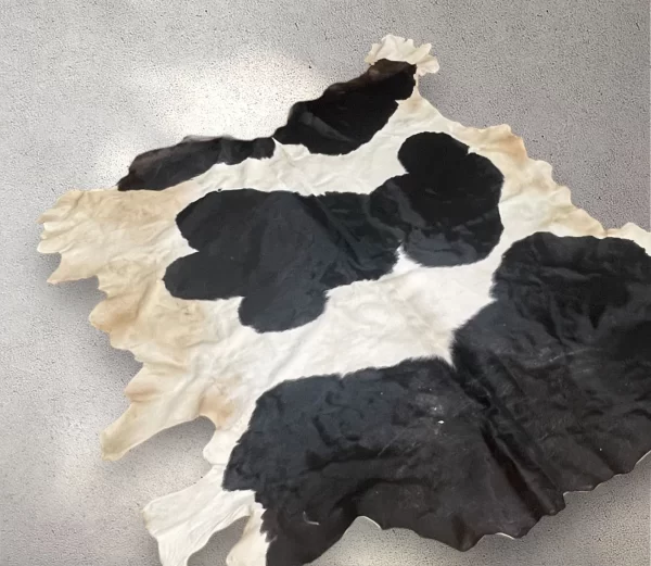 Authentic Egyptian Cowhide Rug in Black, White, and Dust of Brown