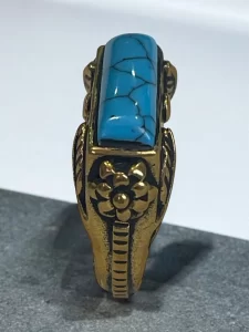 Turquoise Stone Brass Ring with Intricate Floral Engravings