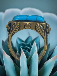 Turquoise Stone Brass Ring with Intricate Floral Engravings