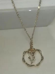 Gold Floral Pendant Necklace with Minimalistic Design