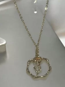 Gold Floral Pendant Necklace with Minimalistic Design