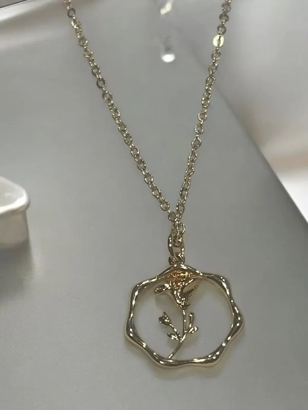 Gold Floral Pendant Necklace with Minimalistic Design
